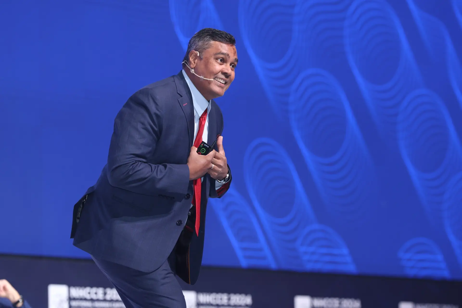 AI keynote speaker Jerome Joseph delivering a keynote in Singapore on branding, leadership, and AI innovation