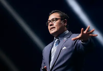 AI keynote speaker Jerome Joseph delivering a keynote in Singapore on branding, leadership, and AI innovation